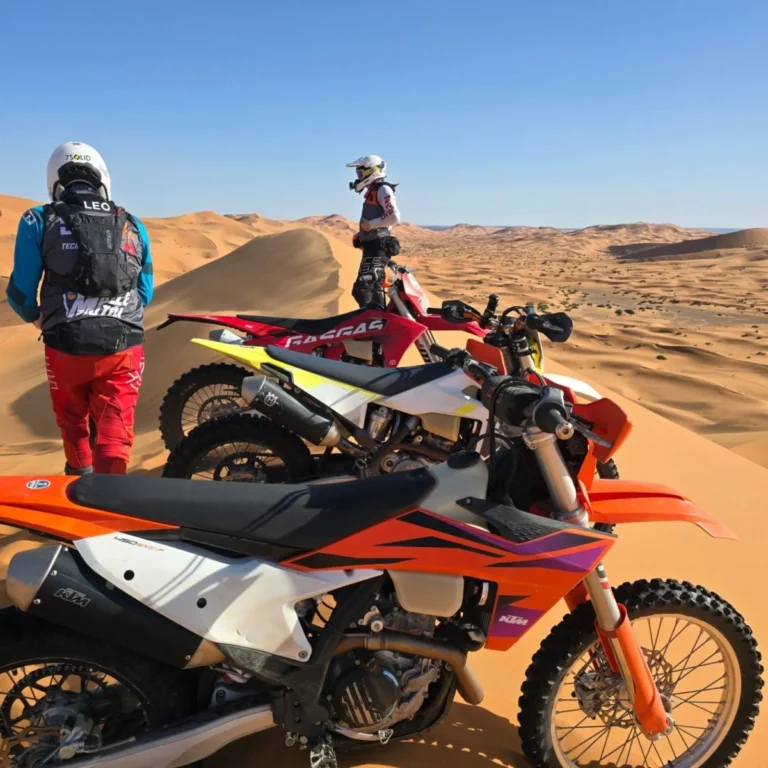 KTM 450 EXC-F and enduro motorcycles on top of the Erg Chebbi dunes in Merzouga